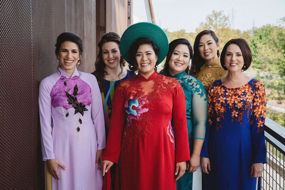 Amy and bridesmaids in traditional Vietnamese gowns before her Vietnamese-American wedding at the Bridge Building, a downtown Nashville wedding venue