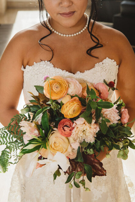 Fall bridal bouquet with peach and coral blooms