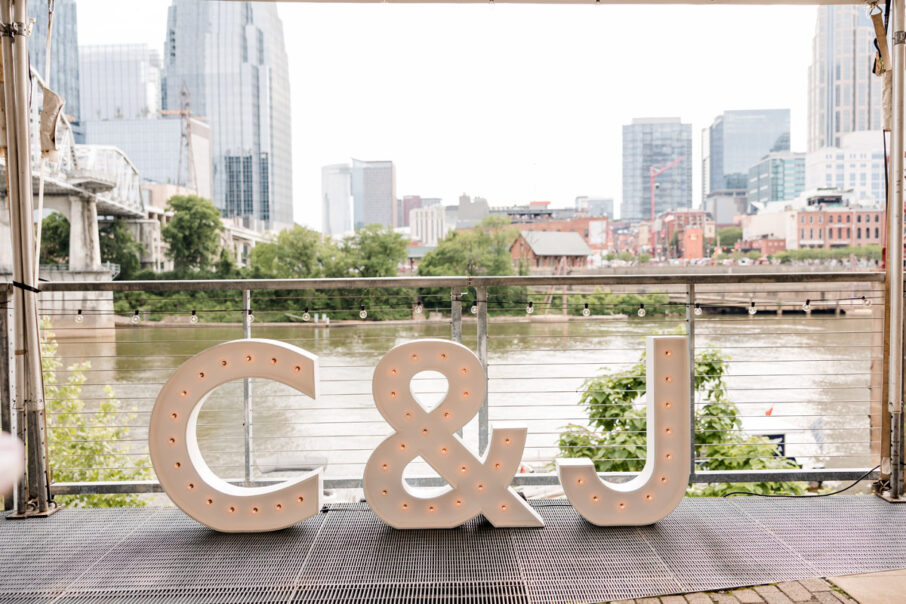 C and J Marquee Letters on Riverside Patio during the Day
