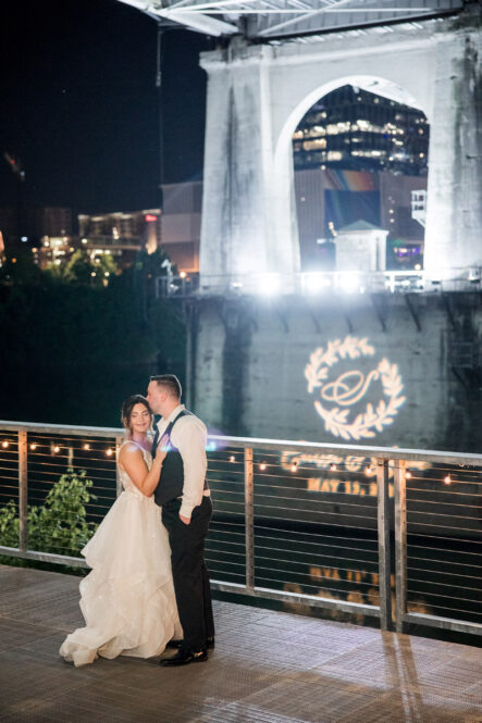 Carissa and Jarrod Outside with Their Custom Gobo on the Bridge
