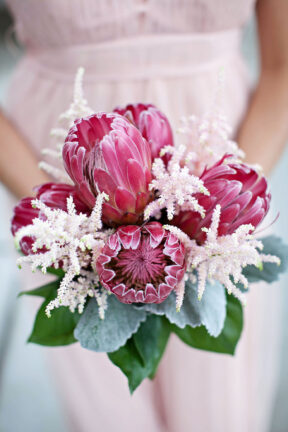 Unique bridesmaid bouquet with large pink protea flowers