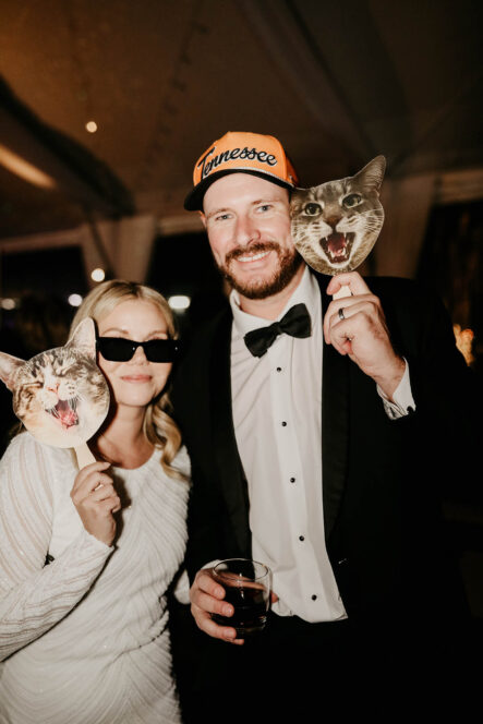 Haley and Andrew with their cat signs during reception