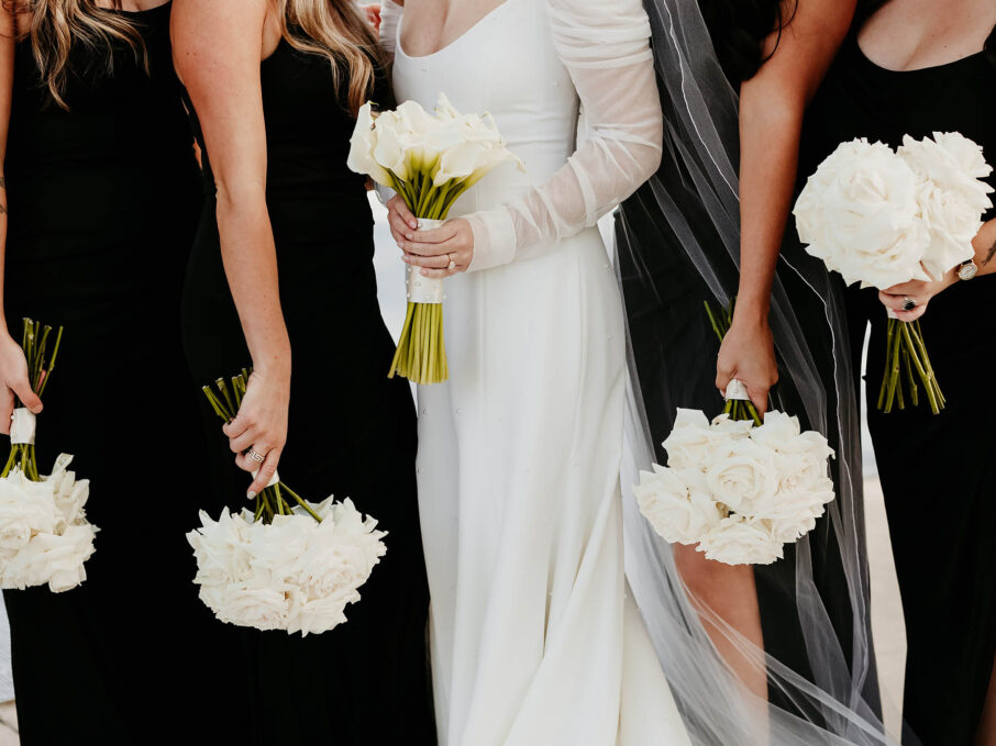 Haley and Her Bridesmaids in Matching Black Dresses with White Bouquets