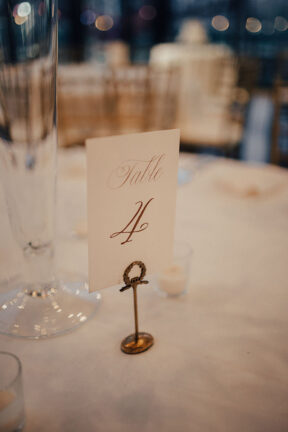 Classic gold and white table number at the Bridge Building, a downtown Nashville wedding venue